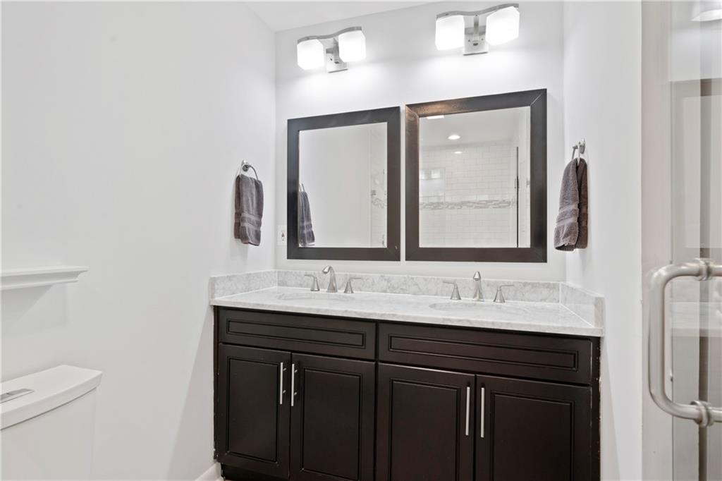 3363 Briarcliff Road Northeast Atlanta, GA 30345 - Photo 31 of 44 a bathroom with a double vanity sink and a mirror