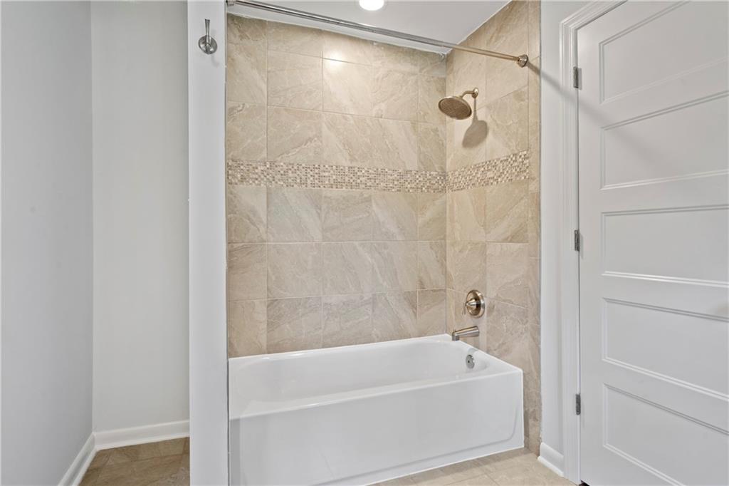 3363 Briarcliff Road Northeast Atlanta, GA 30345 - Photo 35 of 44 a bathroom with a bathtub and shower