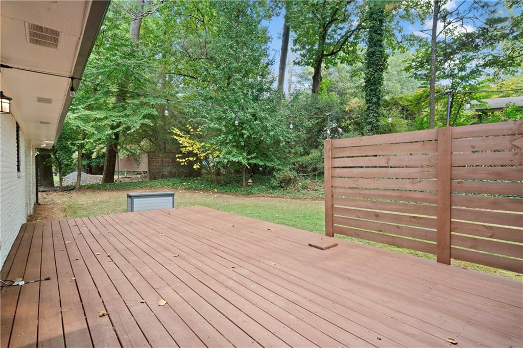 3363 Briarcliff Road Northeast Atlanta, GA 30345 - Photo 39 of 44 a view of a backyard with wooden floors and trees