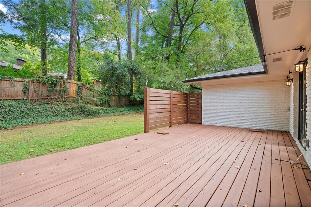 3363 Briarcliff Road Northeast Atlanta, GA 30345 - Photo 40 of 44 a wooden bench sitting in middle of a yard