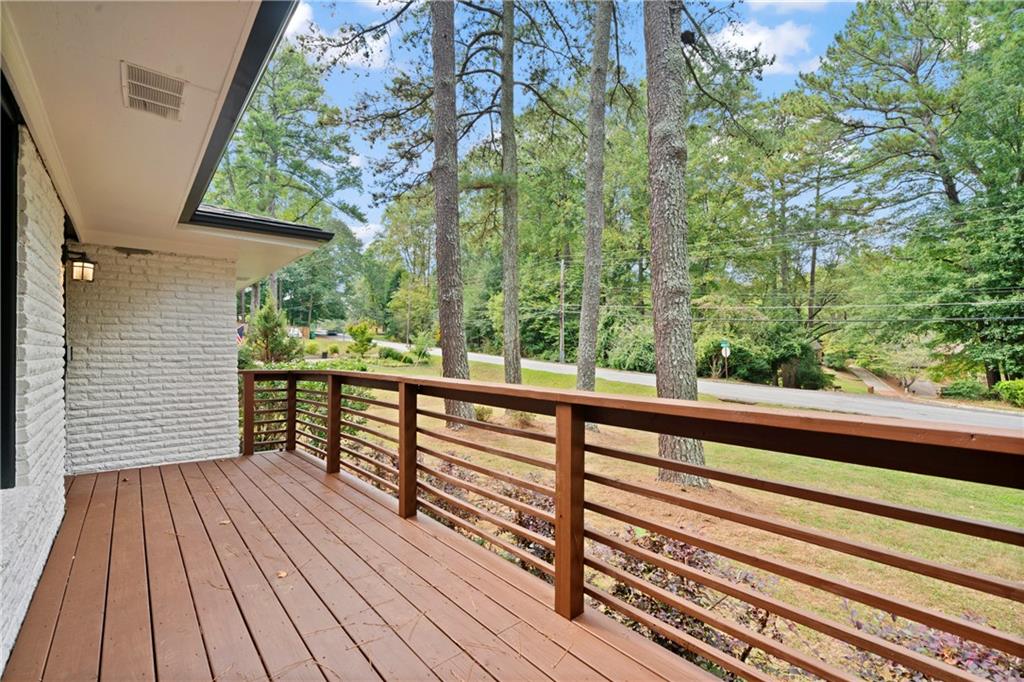 3363 Briarcliff Road Northeast Atlanta, GA 30345 - Photo 4 of 44 a view of balcony with wooden floor and fence