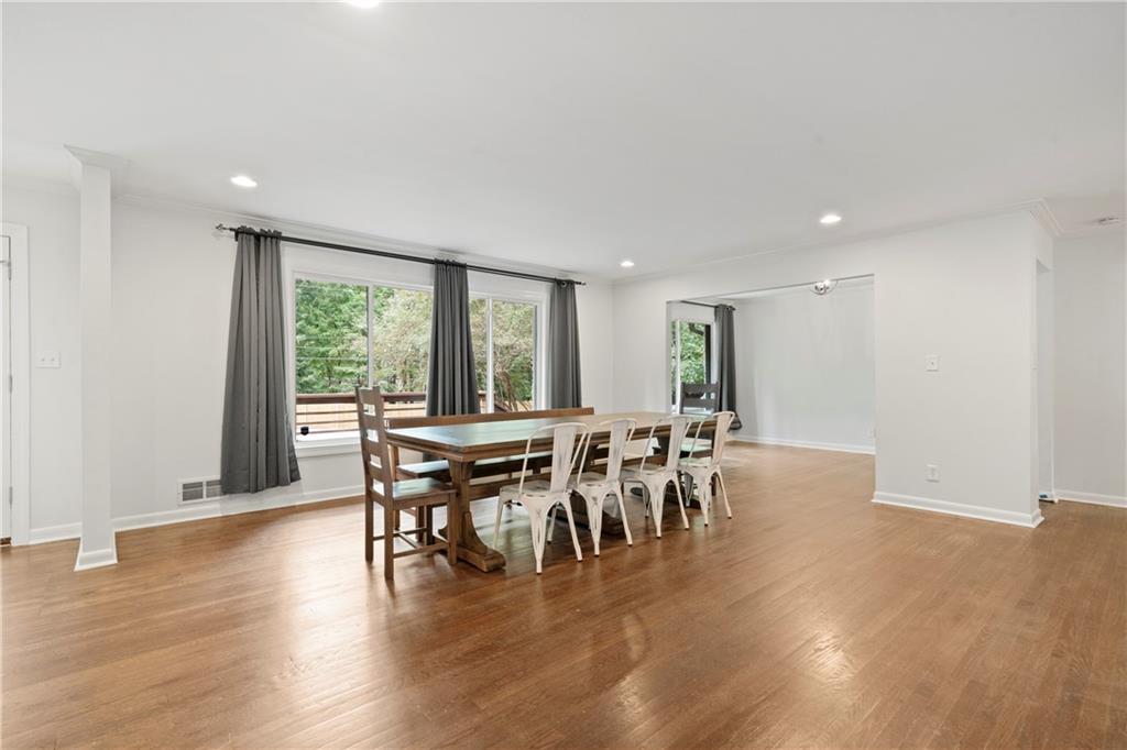 3363 Briarcliff Road Northeast Atlanta, GA 30345 - Photo 8 of 44 a view of a dining room with furniture window and wooden floor