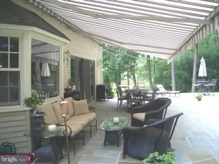6775 Phillips Mill Road New Hope, PA 18938 - Photo 5 of 6 a outdoor space with patio the couches and a dining table with garden view