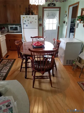 a dining room with furniture and window