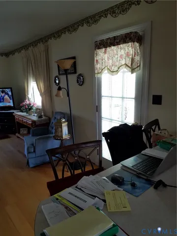 a bedroom with furniture and a window