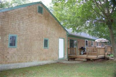 28 Deer Ridge Road Mashpee, MA 02649 - Photo 12 of 13 a view of backyard with deck