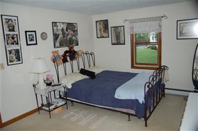 28 Deer Ridge Road Mashpee, MA 02649 - Photo 8 of 13 a bedroom with a bed and a window