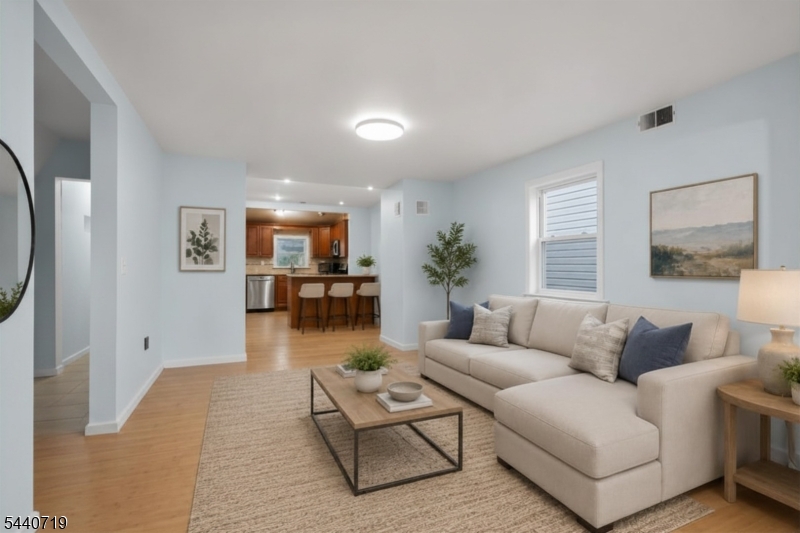 136 Smith Street Elizabeth, NJ 07201 - Photo 17 of 38 a living room with furniture and wooden floor