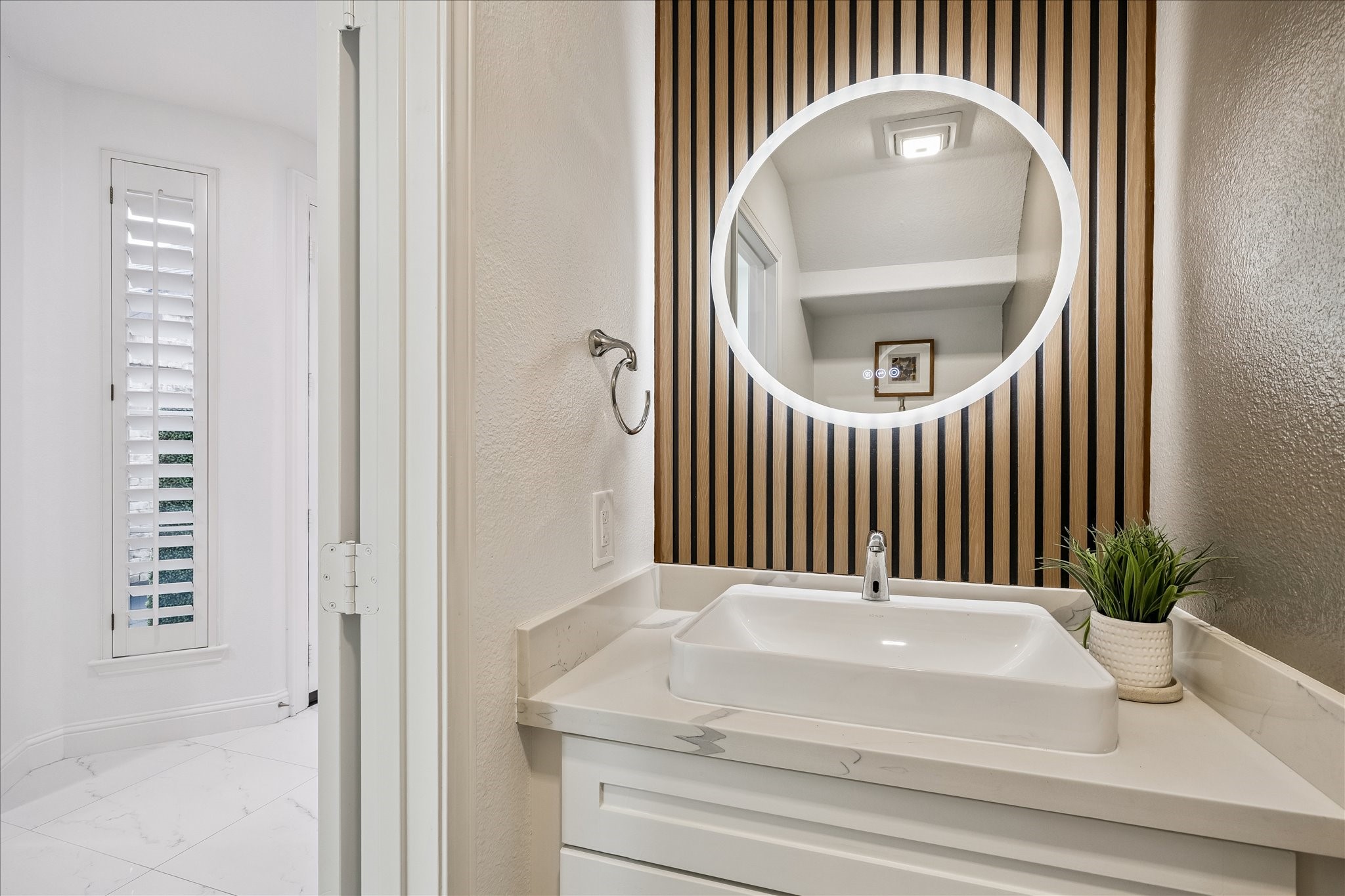 15 West Beckonvale Circle The Woodlands, TX 77382 - Photo 16 of 44 Updated powder bathroom convenient for guests!