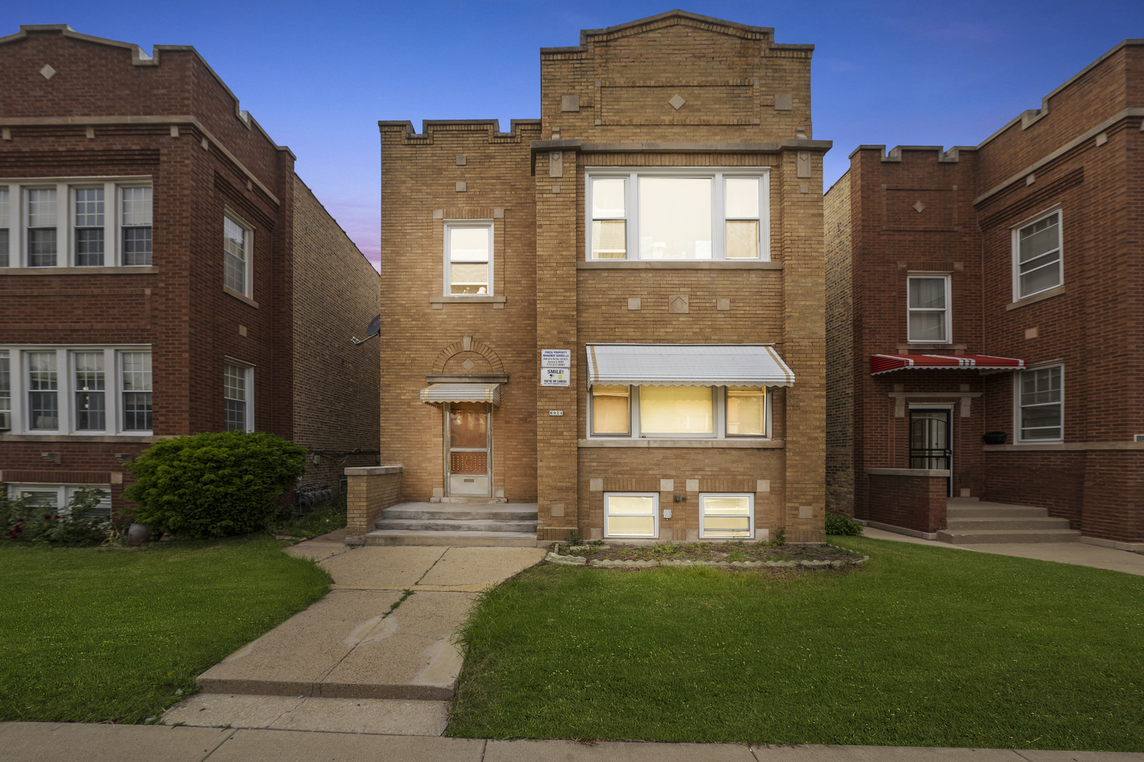 a front view of a house with a yard