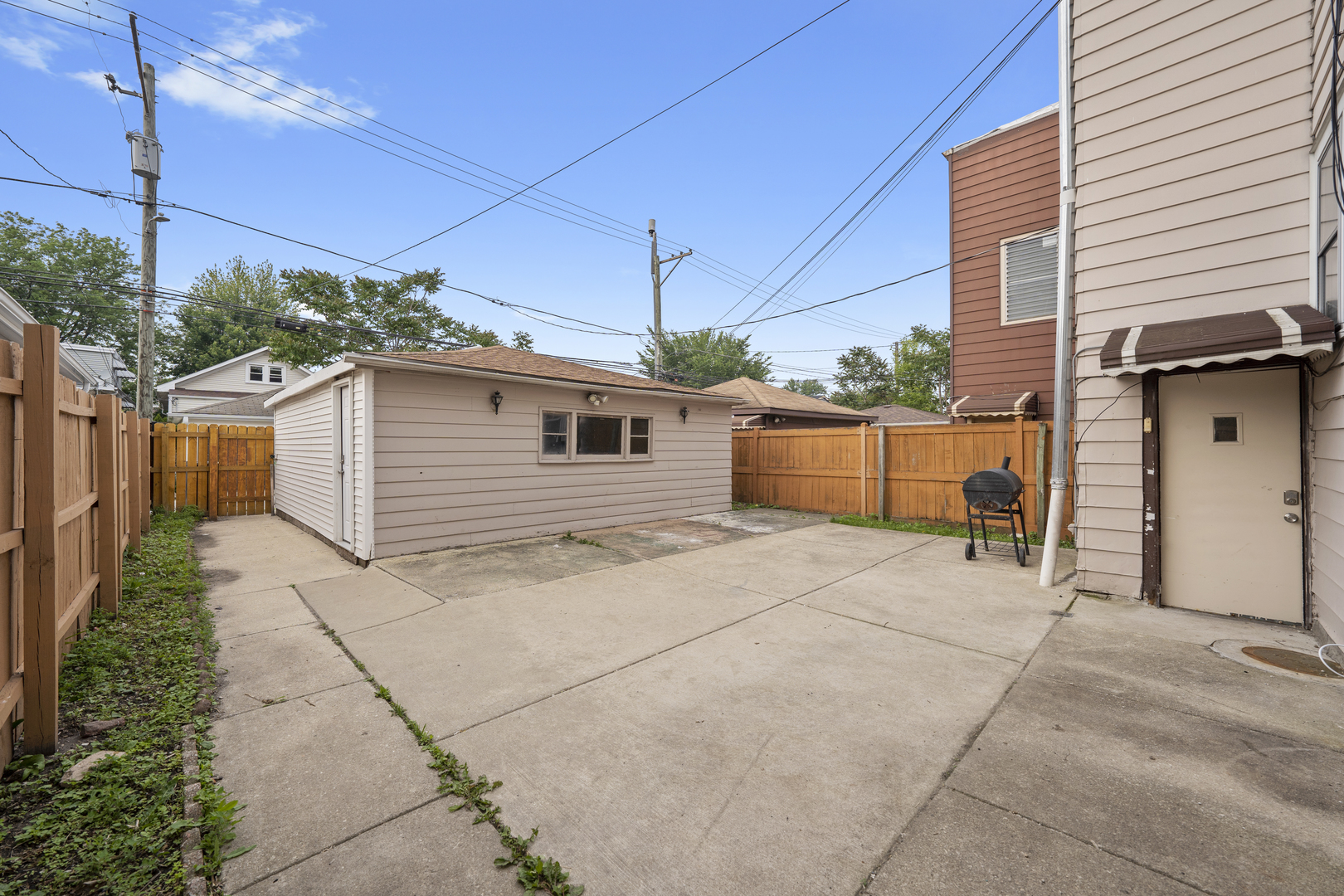 6024 West Addison Street Chicago, IL 60634 - Photo 3 of 11 a backyard of a house with plants and outdoor seating
