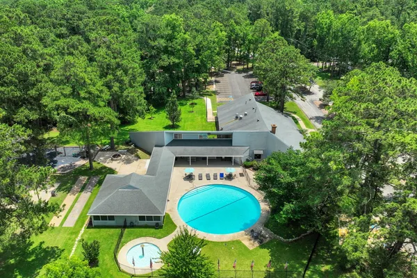 an aerial view of a house with garden space sitting space and swimming pool