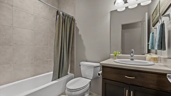 a utility room with sink dryer and washer