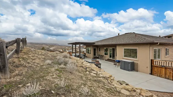 an aerial view of a house with a ocean view