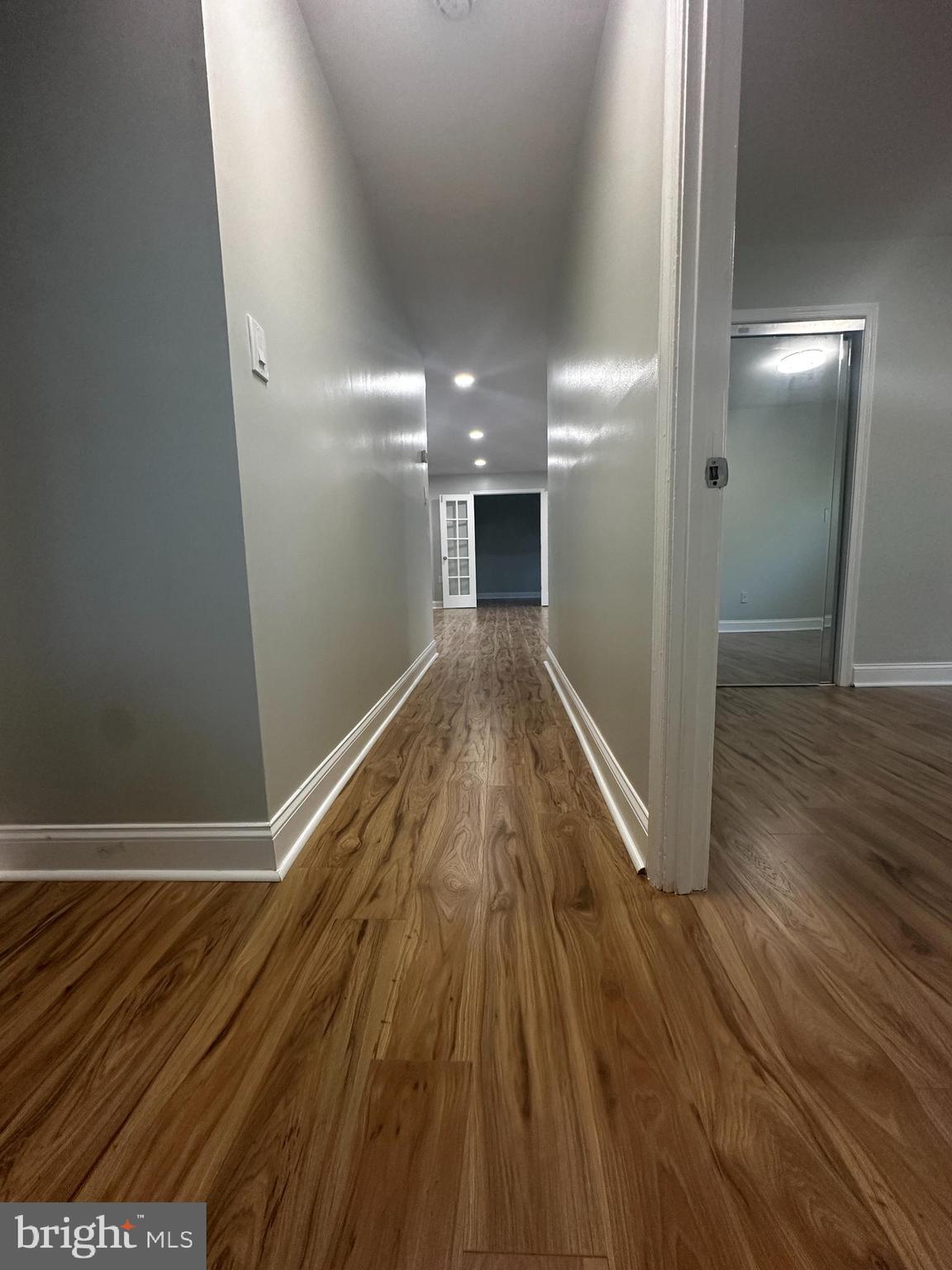 1130 South Washington Street, Unit T2 Falls Church, VA 22046 - Photo 16 of 24 a view of a hallway with wooden floor