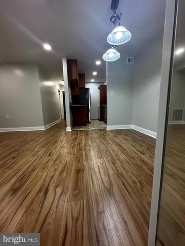a view of a livingroom with a kitchen