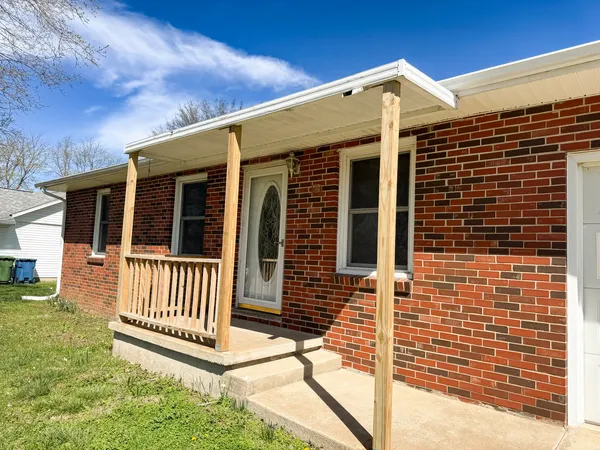 a front view of a house with a porch