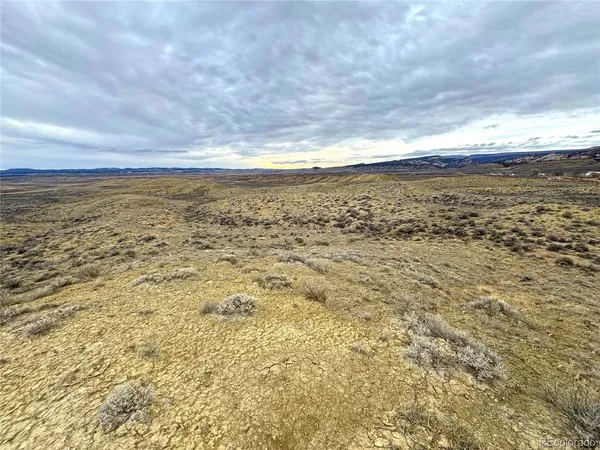 a view of ocean with a mountain