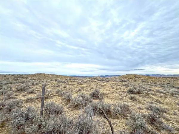a view of a large building with a yard