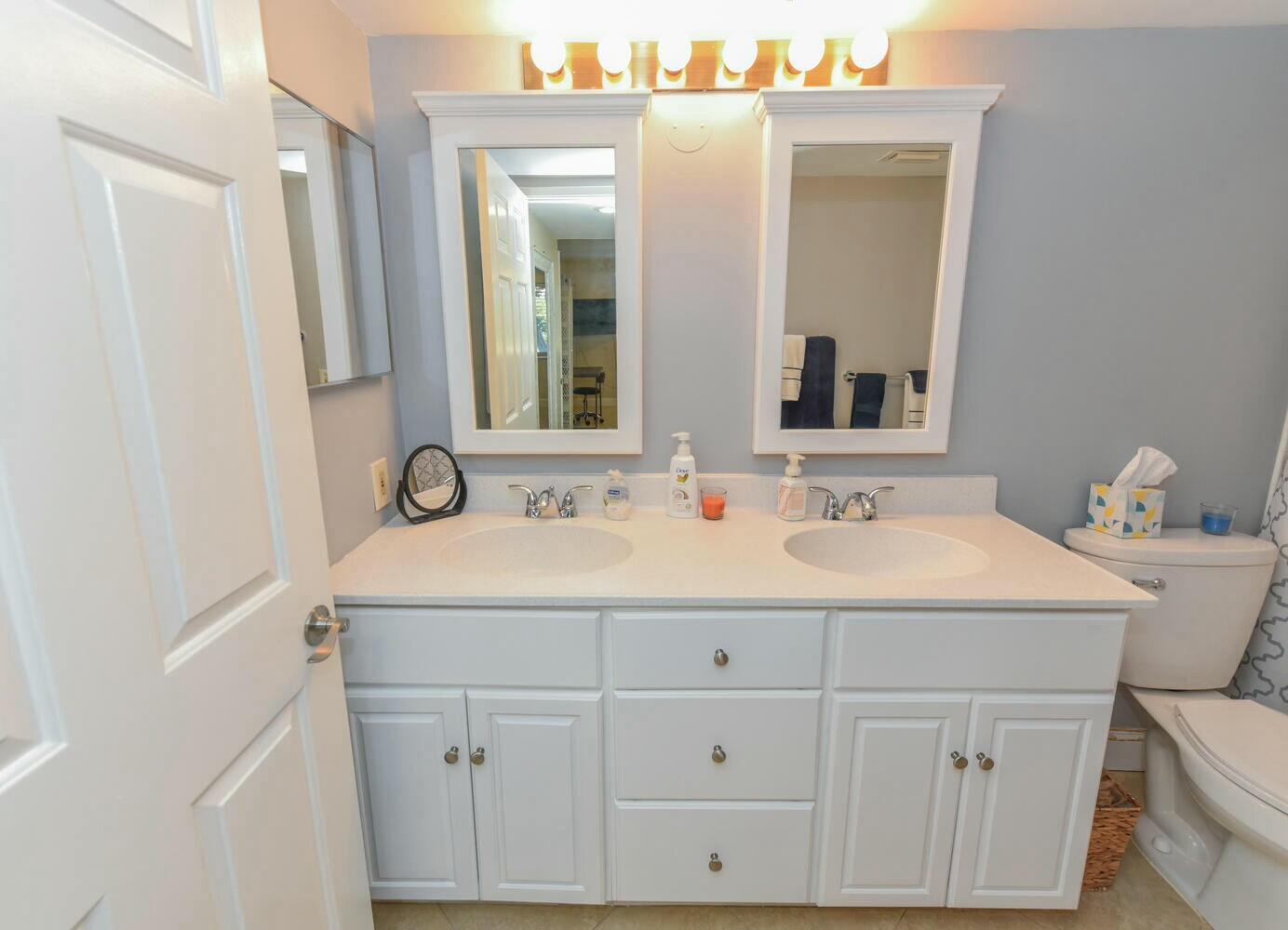 275 Palm Avenue, Unit B106 Jupiter, FL 33477 - Photo 17 of 43 a bathroom with a sink and a mirror