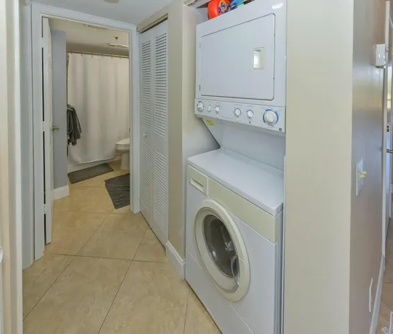 a view of a hallway with washer and dryer