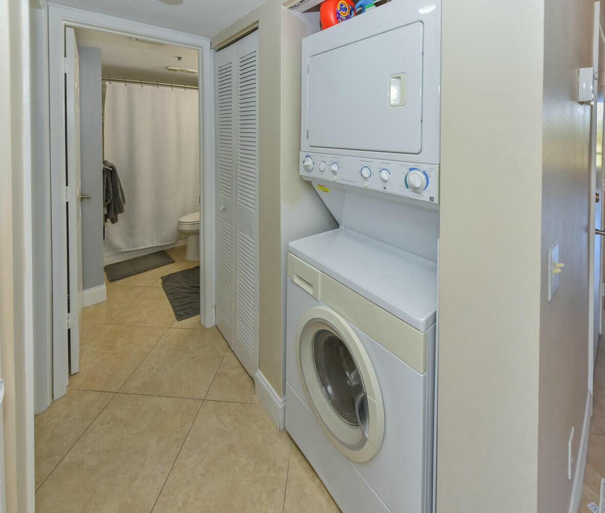 275 Palm Avenue, Unit B106 Jupiter, FL 33477 - Photo 22 of 43 a view of a hallway with washer and dryer