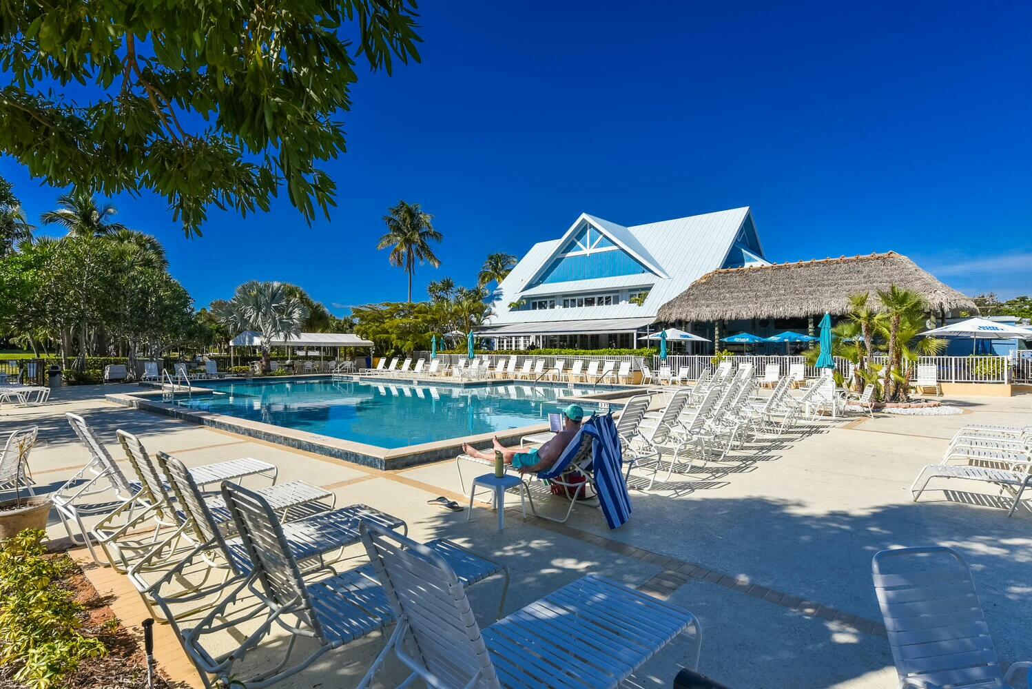 275 Palm Avenue, Unit B106 Jupiter, FL 33477 - Photo 42 of 43 a view of a swimming pool with a patio