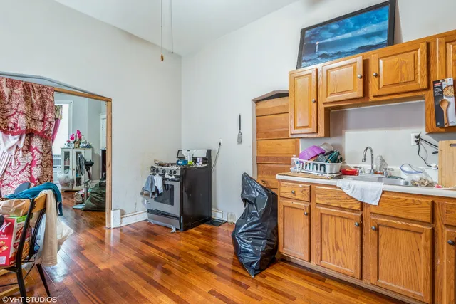 a kitchen with stainless steel appliances granite countertop a refrigerator and microwave