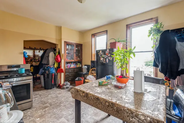 a living room filled with furniture and a flat screen tv