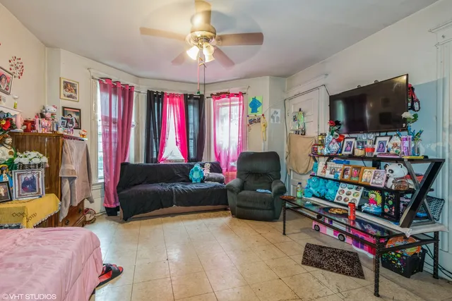a living room with lots of furniture and a flat screen tv