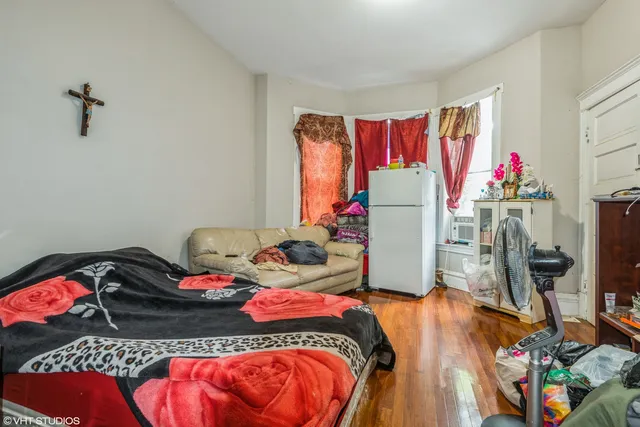 a bedroom with a bed and a dresser