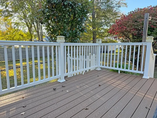 a view of deck with wooden floor and fence