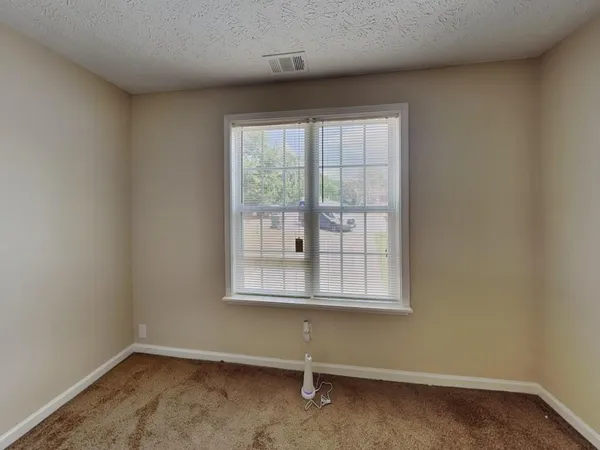 a bathroom with a bathtub and window