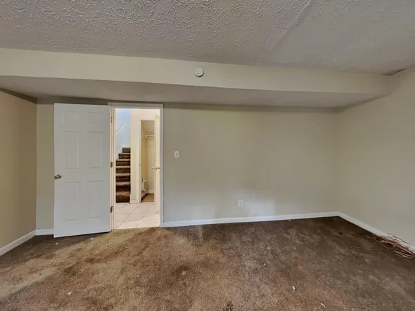 a bathroom with a bathtub and a toilet