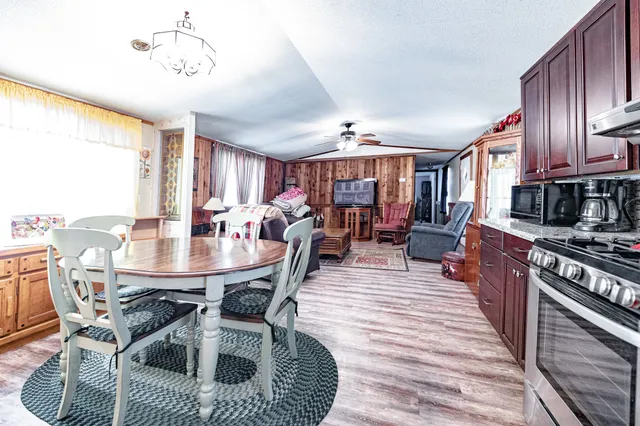 a view of a dining room with furniture window and wooden floor