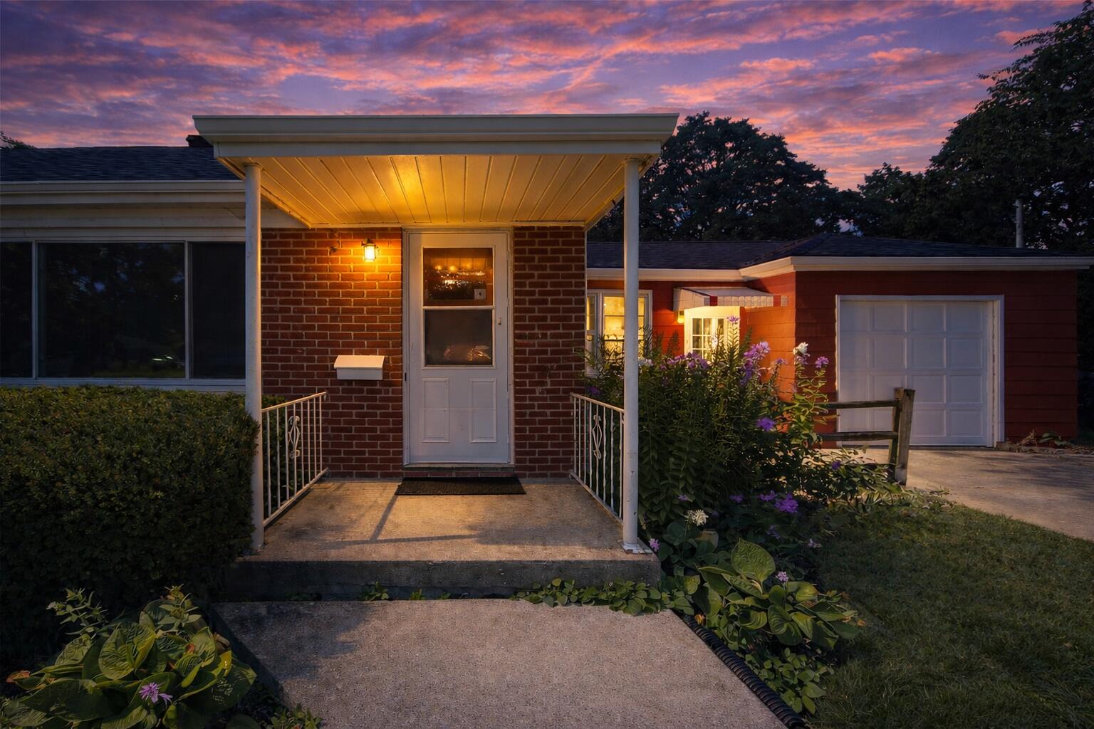 2618 James Boulevard Racine, WI 53403 - Photo 2 of 38 Twilight glow over red brick home