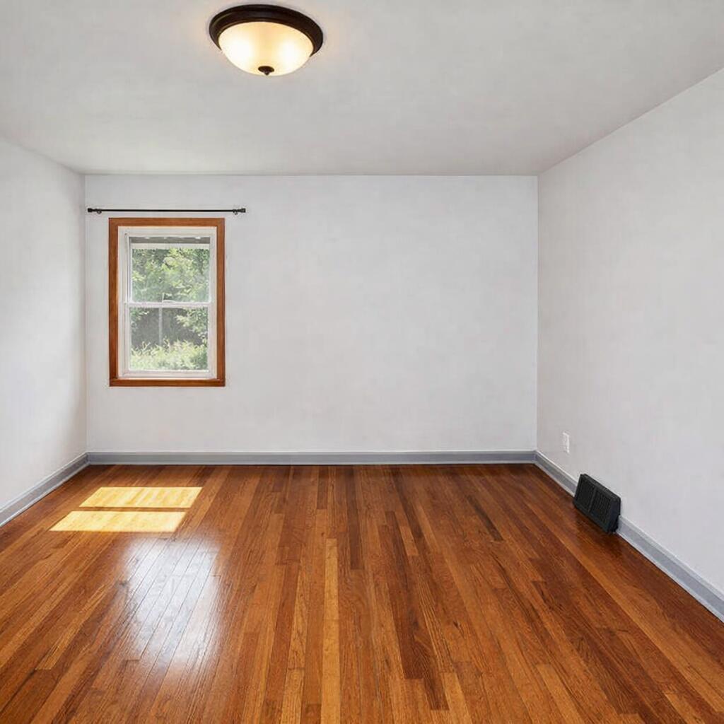 2618 James Boulevard Racine, WI 53403 - Photo 21 of 38 Empty room with hardwood flooring and su