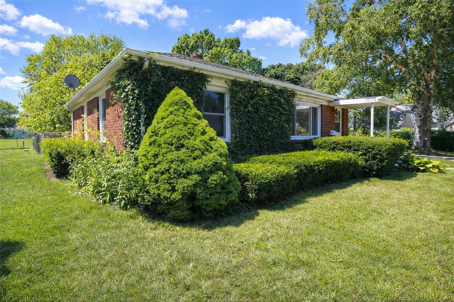 2618 James Boulevard Racine, WI 53403 - Photo 36 of 38 Suburban home with ivy and greenery