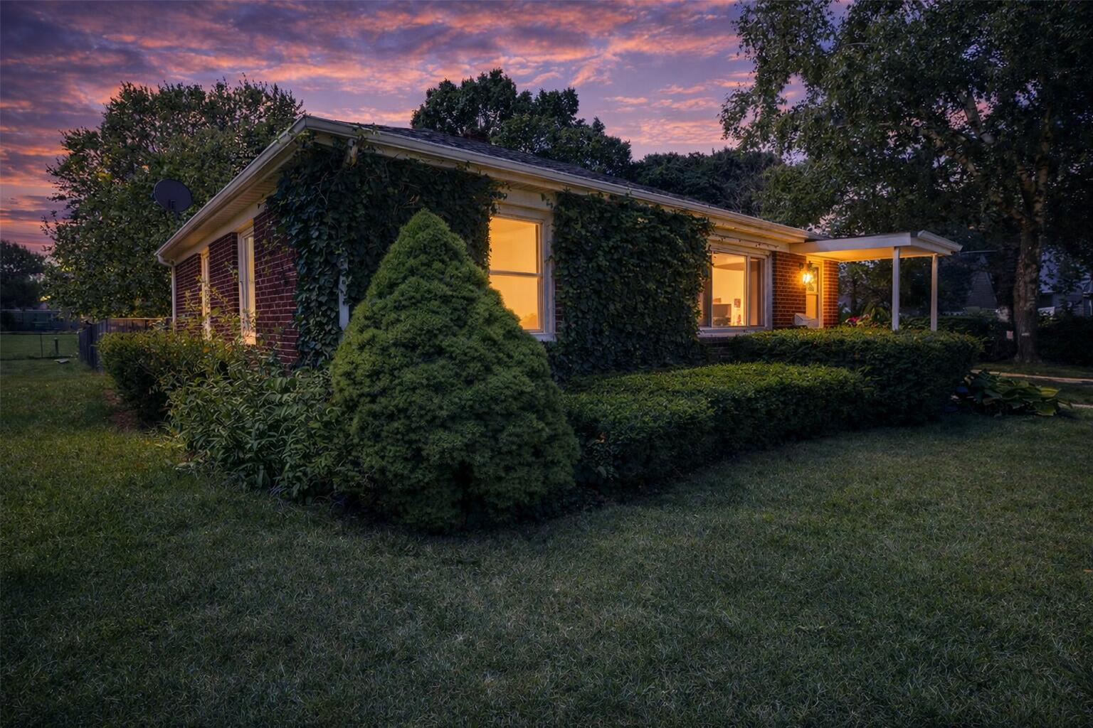 2618 James Boulevard Racine, WI 53403 - Photo 6 of 38 Twilight at a suburban home