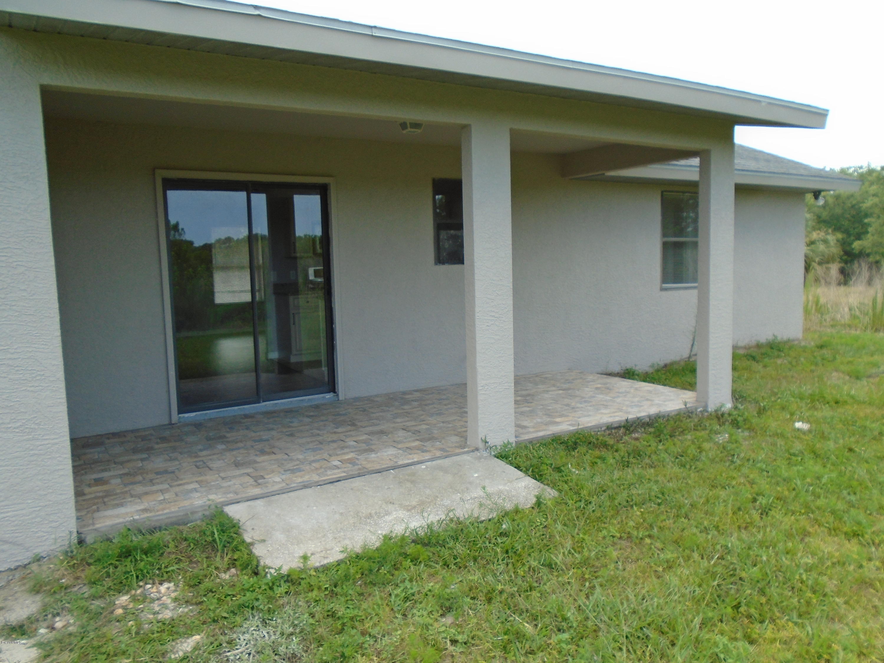 2597 Simon Road Melbourne, FL 32904 - Photo 2 of 12 back patio