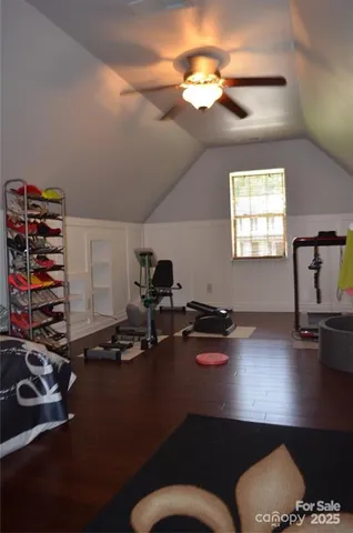 a room with furniture a chandelier and a window