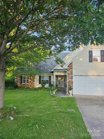 a view of a house with a yard porch and sitting area