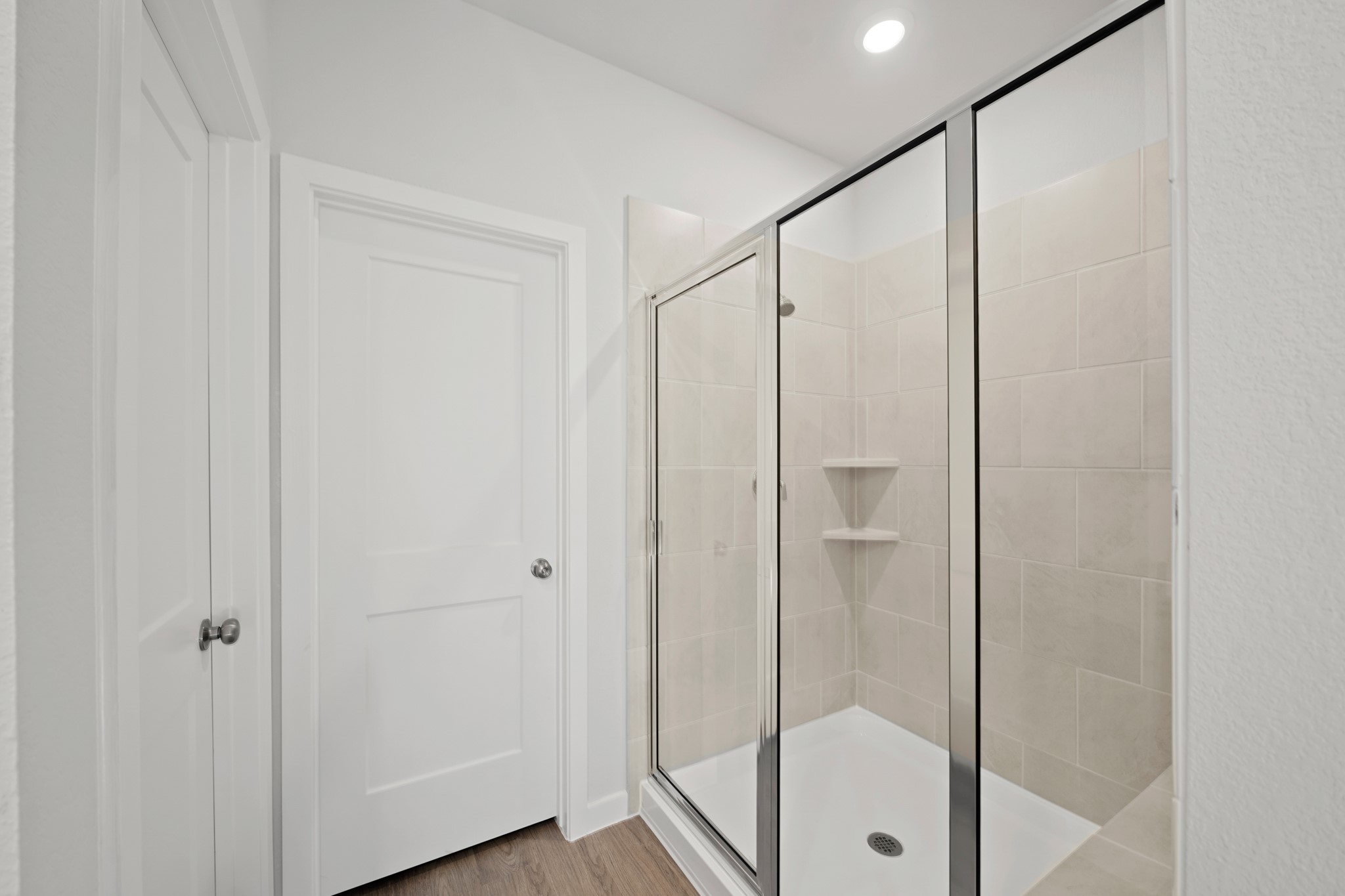 9798 Caney Bend Road Conroe, TX 77303 - Photo 12 of 27 a bathroom with a glass shower door