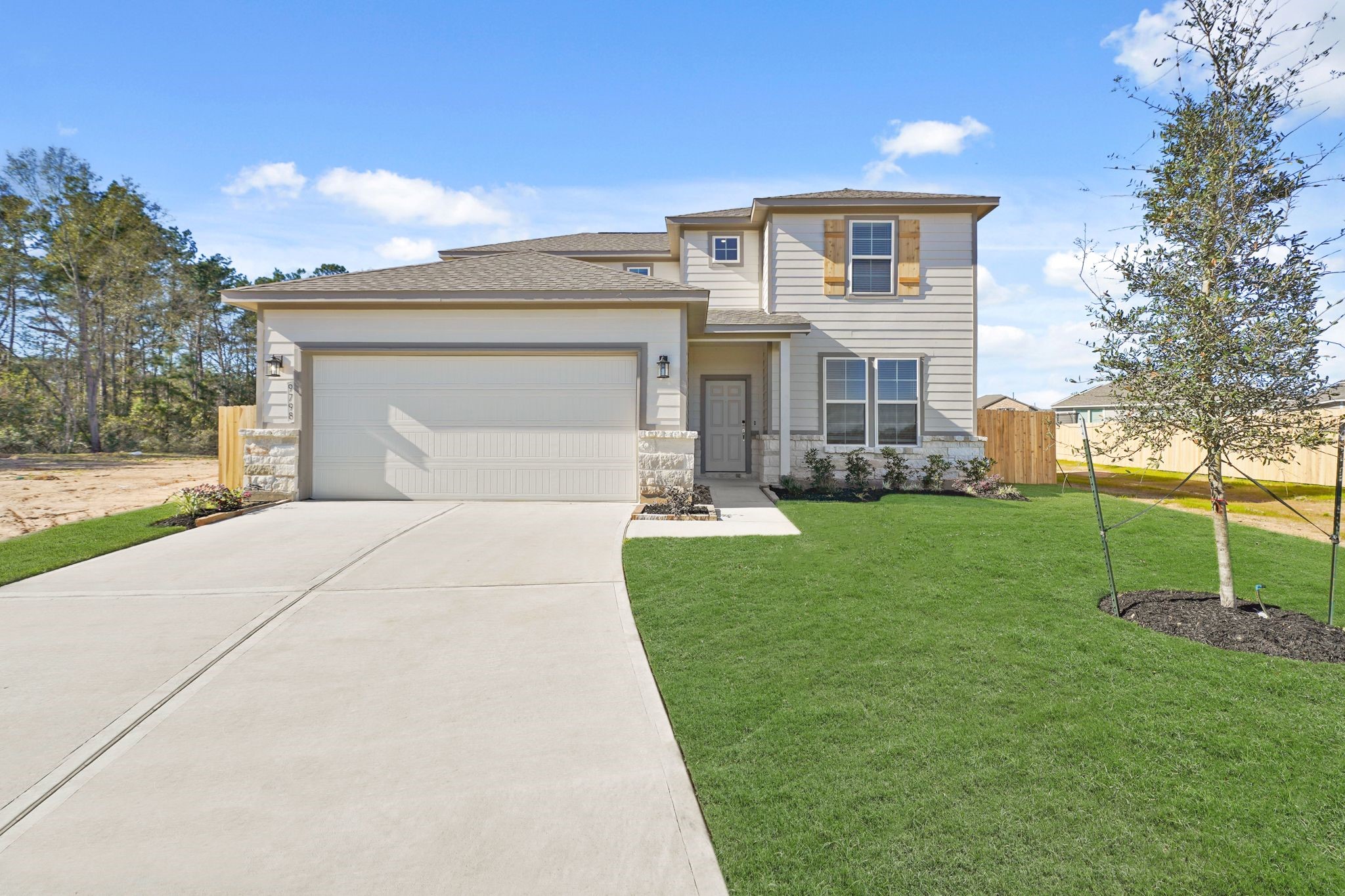 9798 Caney Bend Road Conroe, TX 77303 - Photo 2 of 27 a front view of a house with a yard