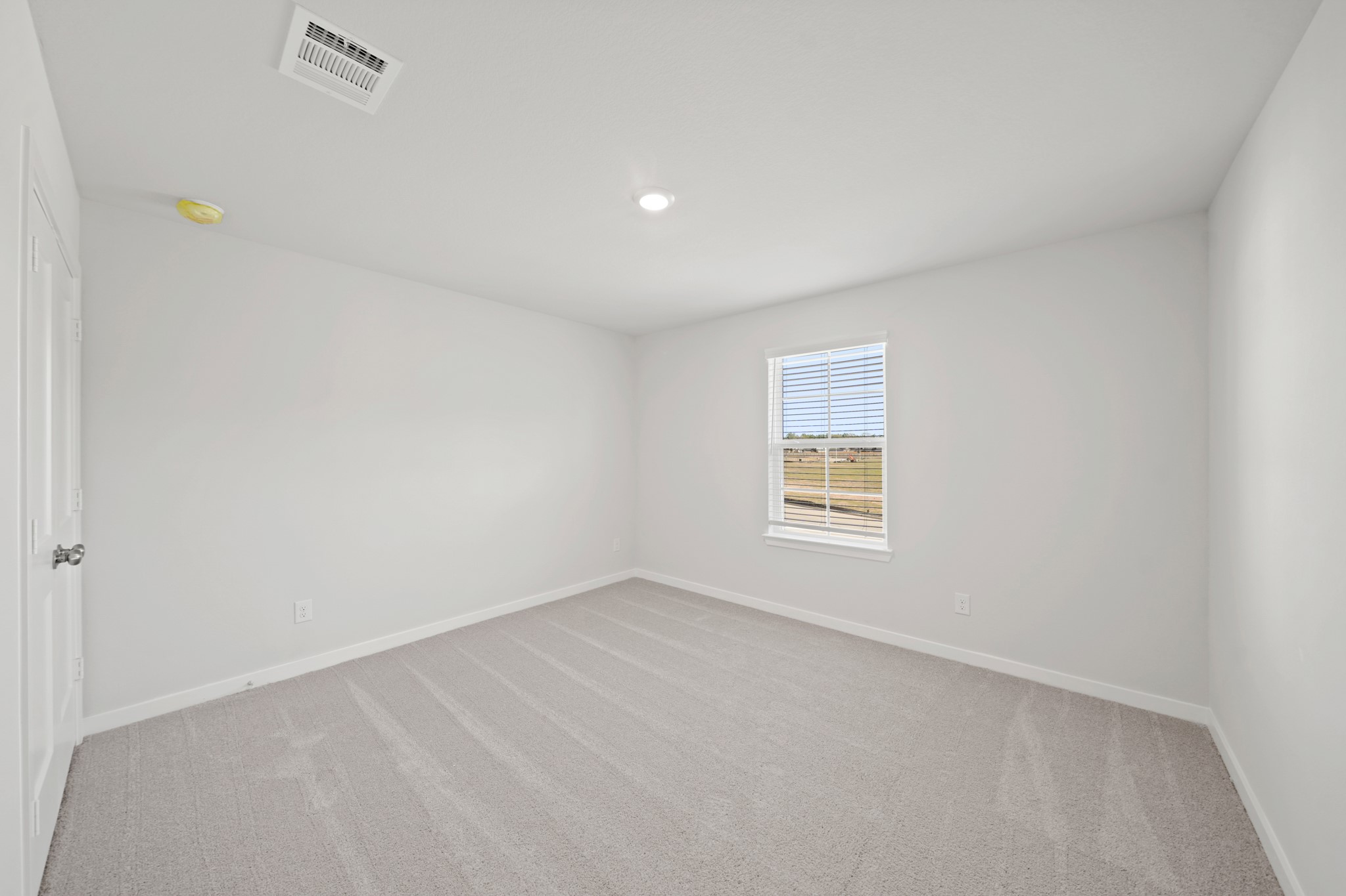 9798 Caney Bend Road Conroe, TX 77303 - Photo 22 of 27 a view of an empty room with a window