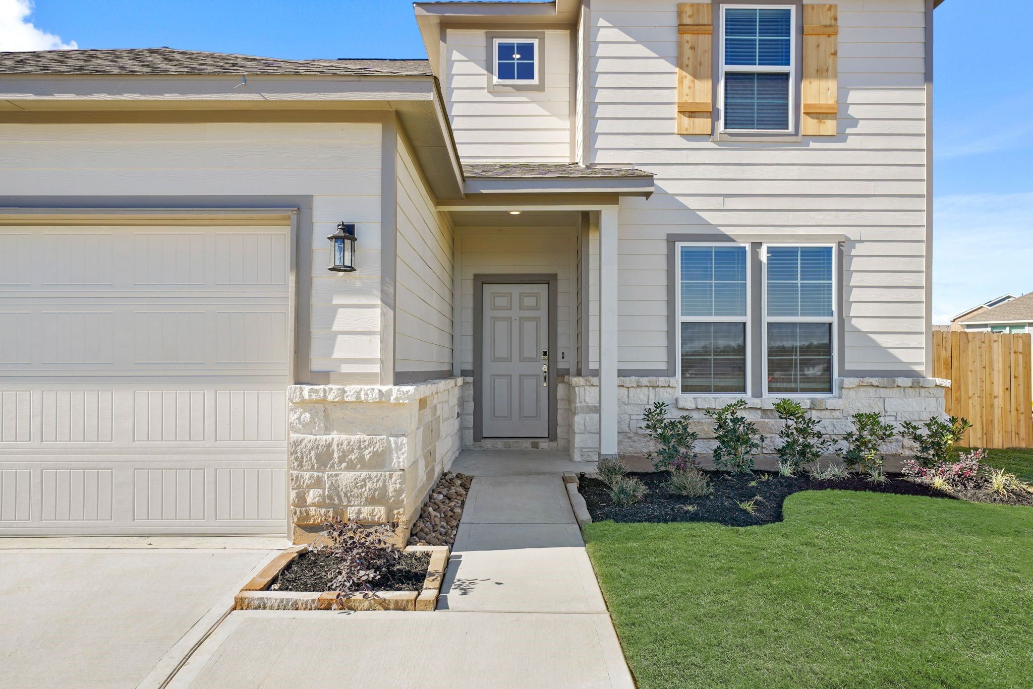 9798 Caney Bend Road Conroe, TX 77303 - Photo 3 of 27 a front view of a house with garden