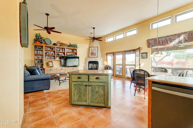 a dining area with a table and chairs