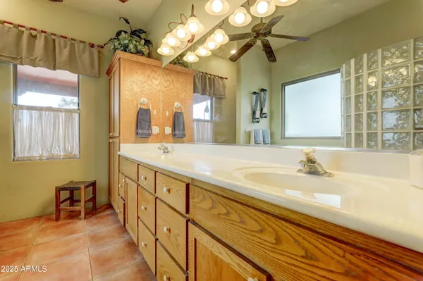 a bathroom with a tub a sink and a shower