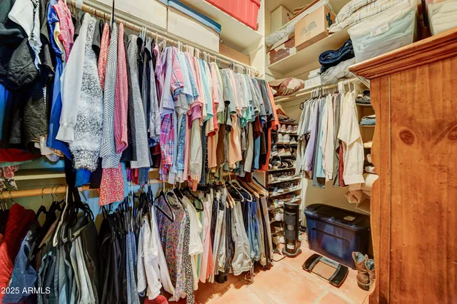 a bedroom with a bed and a cabinets