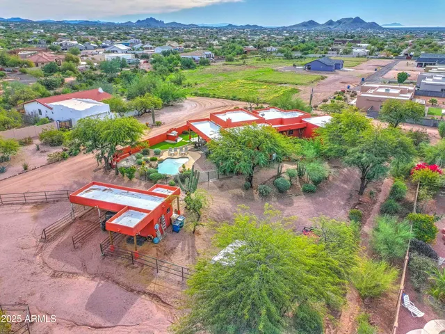 an aerial view of residential houses with outdoor space